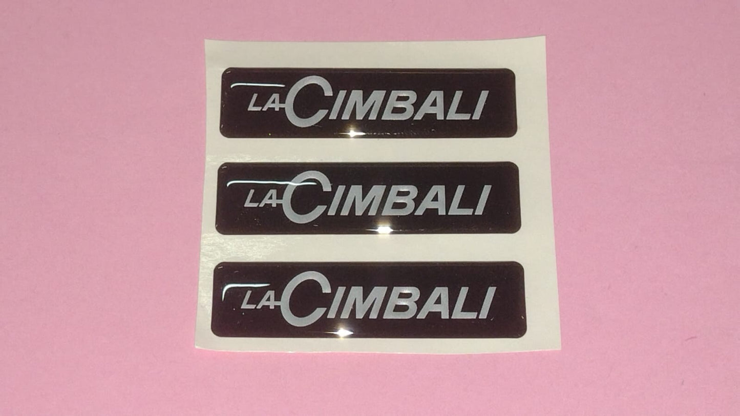 TARGHETTA ADESIVA LA CIMBALI 465425010 55x15mm