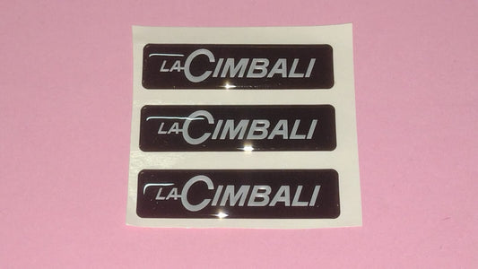 TARGHETTA ADESIVA LA CIMBALI 465425010 55x15mm